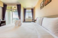Evergreen Suite Hotel客房内的一张或多张床位