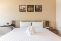 Evergreen Suite Hotel客房内的一张或多张床位