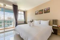 Evergreen Suite Hotel客房内的一张或多张床位