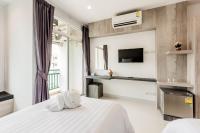 Evergreen Suite Hotel客房内的一张或多张床位