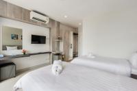 Evergreen Suite Hotel客房内的一张或多张床位