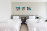 Evergreen Suite Hotel客房内的一张或多张床位