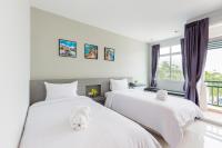 Evergreen Suite Hotel客房内的一张或多张床位