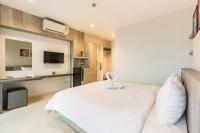Evergreen Suite Hotel客房内的一张或多张床位