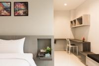 Evergreen Suite Hotel客房内的一张或多张床位