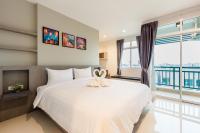 Evergreen Suite Hotel客房内的一张或多张床位