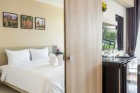 Evergreen Suite Hotel客房内的一张或多张床位