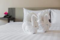 Evergreen Suite Hotel客房内的一张或多张床位