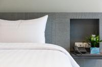 Evergreen Suite Hotel客房内的一张或多张床位