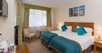 Best Western Moores Central Hotel客房内的一张或多张床位