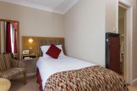 Best Western Moores Central Hotel客房内的一张或多张床位