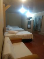 Cumbipar King Hotel客房内的一张或多张床位