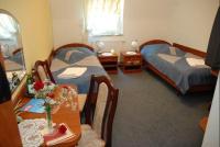 Hotel Restauracja Kaukaska Jadwiga Choroszy客房内的一张或多张床位
