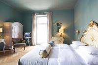 Das REGINA Boutiquehotel客房内的一张或多张床位