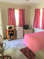 Rosewood Apartment Hotel客房内的一张或多张床位