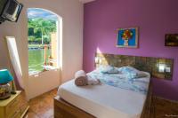 Pousada Casa do Rio Hostel - 8 min do Centro Hístorico - Passeio de Barco com saída da Pousada -Pago a parte- Perto das Praias e Beira Rio客房内的一张或多张床位