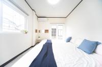 Miraie Yokkaichi Tomida客房内的一张或多张床位