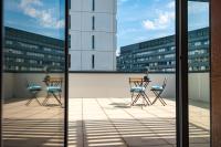 Apparthotel Le Hüb Grenoble的阳台或露台