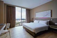 Qliq Damansara Hotel客房内的一张或多张床位