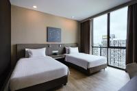 Qliq Damansara Hotel客房内的一张或多张床位