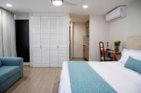 Suites Coben Apartamentos Amueblados客房内的一张或多张床位