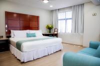 Suites Coben Apartamentos Amueblados客房内的一张或多张床位
