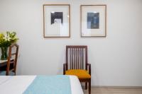 Suites Coben Apartamentos Amueblados客房内的一张或多张床位