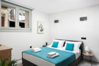 Lignum Suites Chania客房内的一张或多张床位