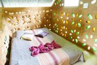 Eco-Logic, Resort for Charity客房内的一张或多张床位