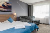 WIND Hotel客房内的一张或多张床位