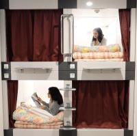 大田市ゲストハウス 雪見院 Guesthouse Yukimi-inn客房内的一张或多张床位