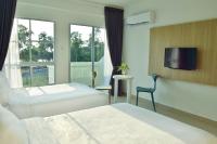 AVI Pangkor Beach Resort客房内的一张或多张床位