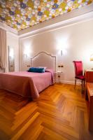 Boutique Hotel Puccini客房内的一张或多张床位