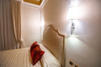 Boutique Hotel Puccini客房内的一张或多张床位