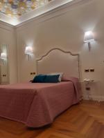 Boutique Hotel Puccini客房内的一张或多张床位