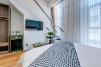 Happy Dragon City Culture Hotel-Tianjin Draum Tower &amp; Dayuecheng shopping mall客房内的一张或多张床位