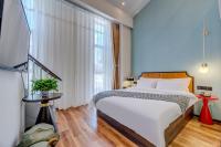 Happy Dragon City Culture Hotel-Tianjin Draum Tower &amp; Dayuecheng shopping mall客房内的一张或多张床位