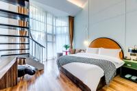 Happy Dragon City Culture Hotel-Tianjin Draum Tower &amp; Dayuecheng shopping mall客房内的一张或多张床位