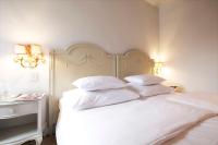 Das REGINA Boutiquehotel客房内的一张或多张床位