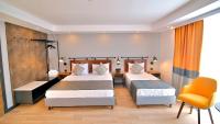 Ramira Joy Hotel客房内的一张或多张床位
