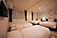 Cozy Inn OTARU客房内的一张或多张床位