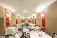 Boutique Hotel Puccini餐厅或其他用餐的地方