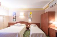 Boutique Hotel Puccini客房内的一张或多张床位