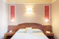 Boutique Hotel Puccini客房内的一张或多张床位