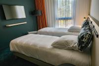 Live Hotels Bordeaux Lac客房内的一张或多张床位