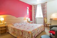 Hôtel A la Vignette - COLMAR-NORD客房内的一张或多张床位