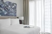 Jumeirah Living Marina Gate Dubai客房内的一张或多张床位