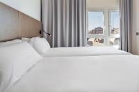 B&B HOTEL Tarragona Centro Urbis客房内的一张或多张床位