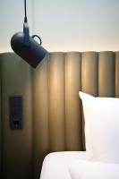ibis Styles Parndorf Neusiedler See客房内的一张或多张床位