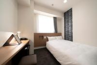 Washington R&B Hotel Nagoya Ekimae客房内的一张或多张床位